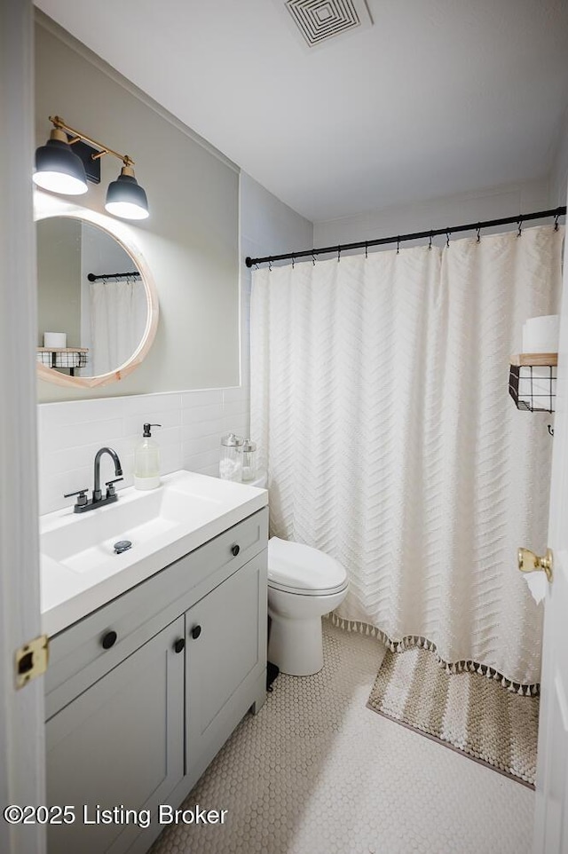 6812 Holly Lake Dr, Louisville, KY 40291 - bathroom featuring vanity, tile walls, and tile patterned floors