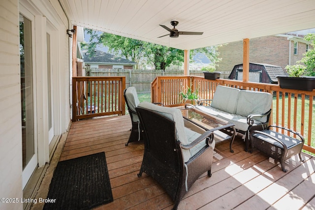 6812 Holly Lake Dr, Louisville, KY 40291 - deck with an outdoor hangout area, a storage shed, a fenced backyard, and ceiling fan
