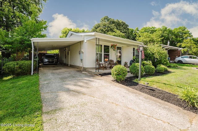 6812 Holly Lake Dr, Louisville, KY 40291 - view of front of property with driveway, a front yard, an attached carport, and a porch