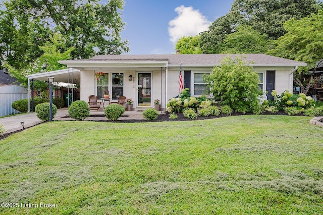 6812 Holly Lake Dr, Louisville, KY 40291 - view of front of house featuring a porch, a front lawn, brick siding, driveway, and a carport