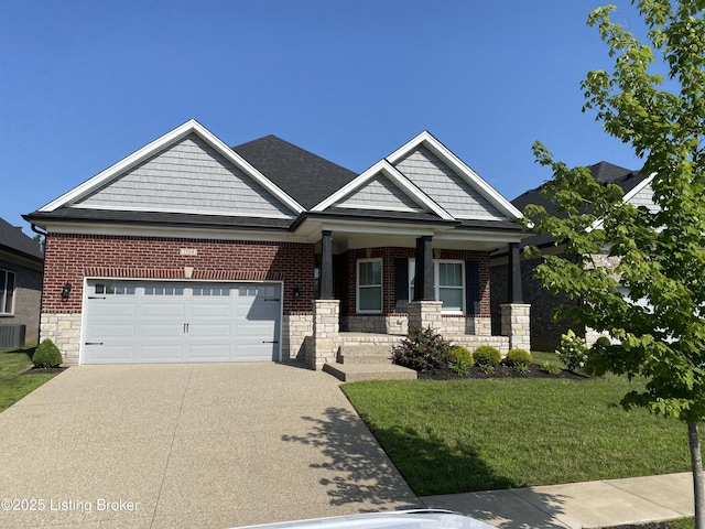 7508 Pavilion Park Rd, Louisville, KY 40214 - craftsman inspired home featuring covered porch, driveway, a front yard, an attached garage, and stone siding