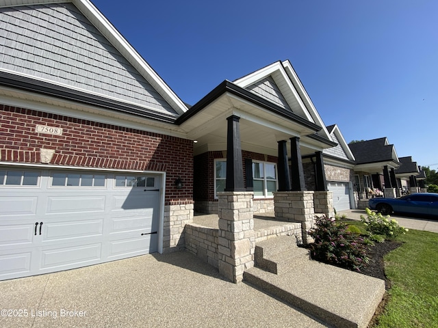 7508 Pavilion Park Rd, Louisville, KY 40214 - view of front of house with brick siding, a garage, a porch, stone siding, and driveway