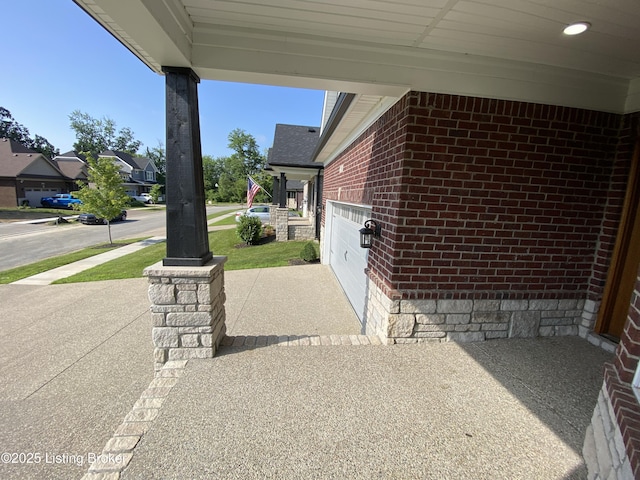 7508 Pavilion Park Rd, Louisville, KY 40214 - view of patio / terrace with an attached garage, driveway, and a residential view