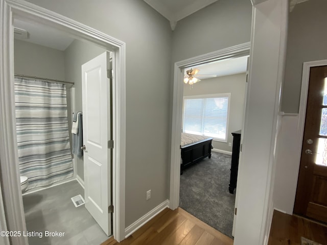 7508 Pavilion Park Rd, Louisville, KY 40214 - full bathroom with wood finished floors, ceiling fan, and curtained shower