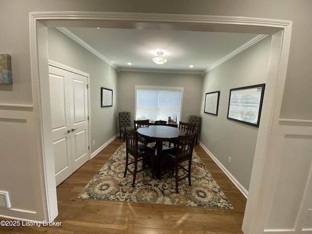 7508 Pavilion Park Rd, Louisville, KY 40214 - dining room with dark wood finished floors, ornamental molding, and recessed lighting