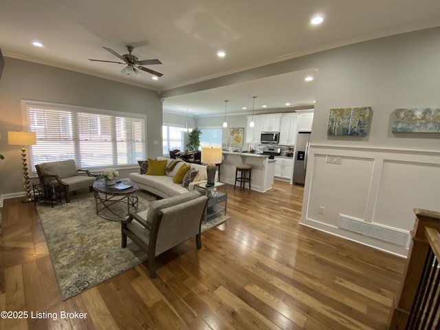 7508 Pavilion Park Rd, Louisville, KY 40214 - living room featuring ornamental molding, a ceiling fan, recessed lighting, and wood finished floors