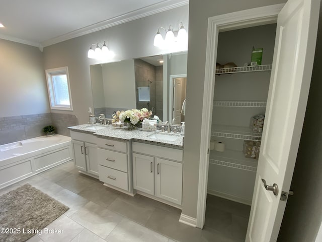 7508 Pavilion Park Rd, Louisville, KY 40214 - bathroom with a stall shower, double vanity, ornamental molding, a garden tub, and a walk in closet