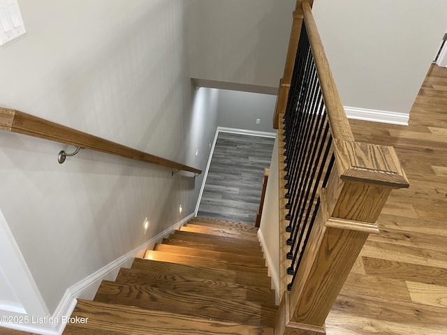 7508 Pavilion Park Rd, Louisville, KY 40214 - staircase featuring wood finished floors and baseboards