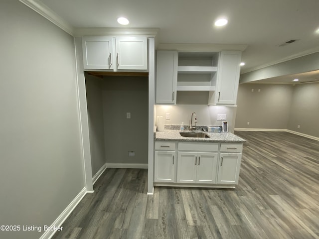 7508 Pavilion Park Rd, Louisville, KY 40214 - kitchen with open shelves, wood finished floors, white cabinets, crown molding, and recessed lighting