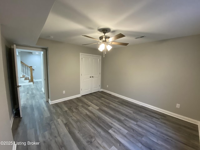 7508 Pavilion Park Rd, Louisville, KY 40214 - unfurnished bedroom with dark wood-type flooring, a ceiling fan, and a closet