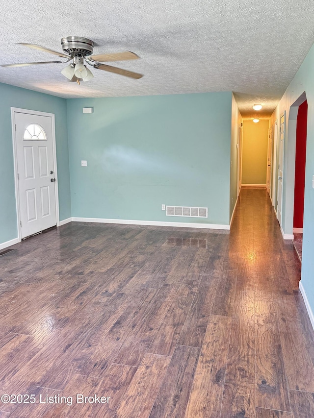 599 Ritchie Dr, Brandenburg, KY 40108 - unfurnished room featuring dark wood-type flooring, ceiling fan, and a textured ceiling