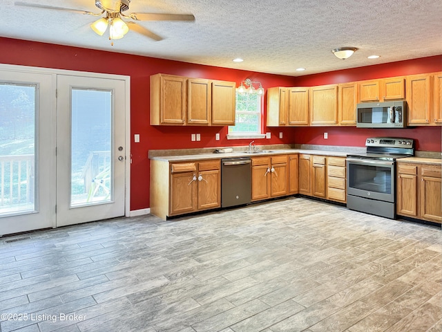 599 Ritchie Dr, Brandenburg, KY 40108 - kitchen featuring appliances with stainless steel finishes, a textured ceiling, light wood finished floors, recessed lighting, and ceiling fan