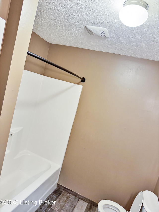 599 Ritchie Dr, Brandenburg, KY 40108 - full bath with wood finished floors and a textured ceiling