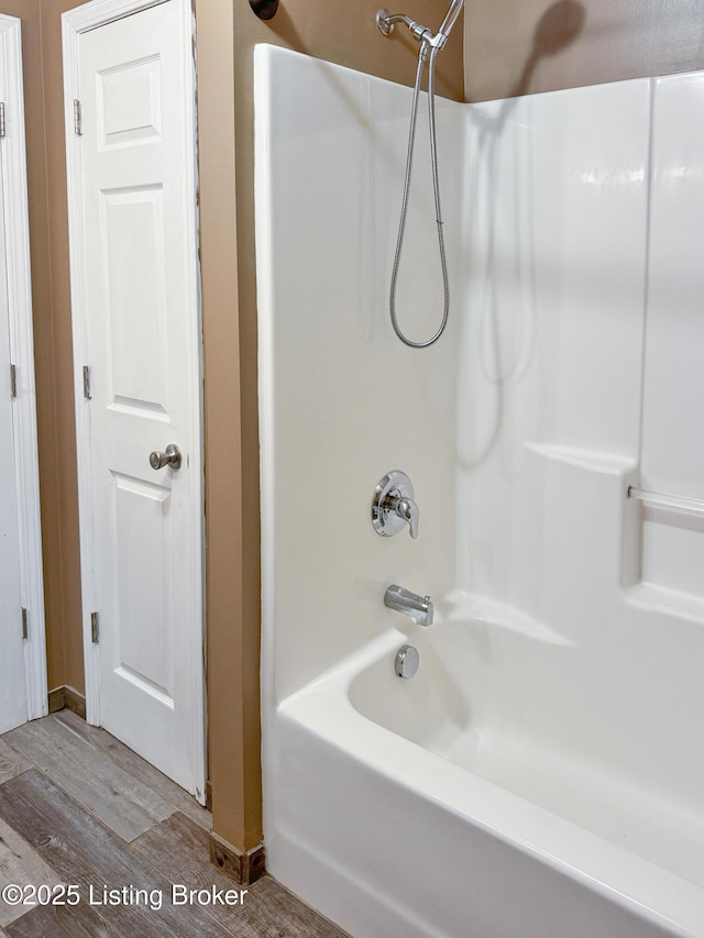 599 Ritchie Dr, Brandenburg, KY 40108 - full bath featuring wood finished floors and  shower combination