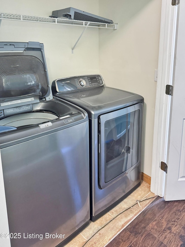 599 Ritchie Dr, Brandenburg, KY 40108 - washroom featuring washer and dryer and wood finished floors
