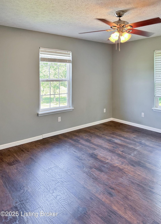 599 Ritchie Dr, Brandenburg, KY 40108 - spare room with healthy amount of natural light, ceiling fan, dark wood-style flooring, and a textured ceiling