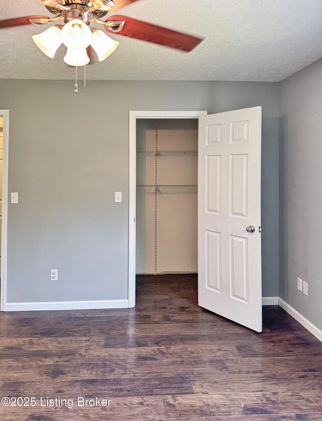 599 Ritchie Dr, Brandenburg, KY 40108 - unfurnished bedroom featuring a closet, wood finished floors, a textured ceiling, and ceiling fan