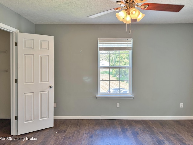 599 Ritchie Dr, Brandenburg, KY 40108 - unfurnished room featuring a ceiling fan, dark wood-style flooring, and a textured ceiling