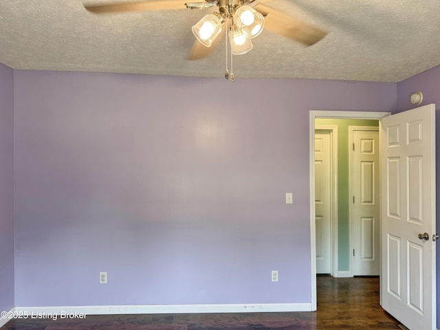 599 Ritchie Dr, Brandenburg, KY 40108 - spare room featuring ceiling fan, a textured ceiling, and dark wood-type flooring