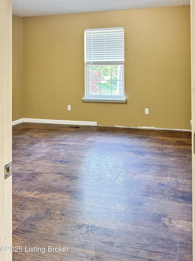 599 Ritchie Dr, Brandenburg, KY 40108 - empty room with wood finished floors and baseboards