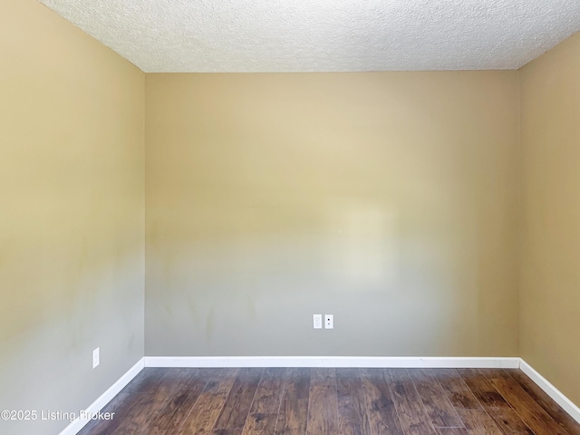 599 Ritchie Dr, Brandenburg, KY 40108 - unfurnished room featuring dark wood-type flooring and a textured ceiling