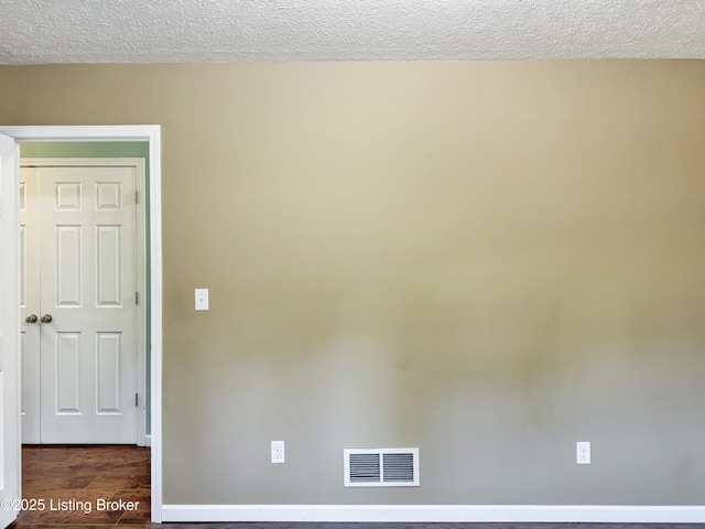 599 Ritchie Dr, Brandenburg, KY 40108 - empty room with wood finished floors and a textured ceiling