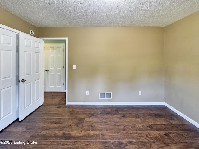 599 Ritchie Dr, Brandenburg, KY 40108 - unfurnished bedroom featuring wood finished floors and a textured ceiling