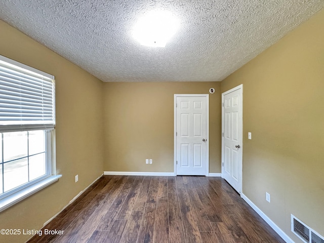 599 Ritchie Dr, Brandenburg, KY 40108 - spare room with dark wood-type flooring and a textured ceiling
