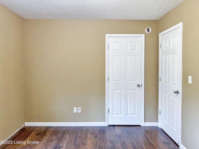599 Ritchie Dr, Brandenburg, KY 40108 - unfurnished bedroom with dark wood finished floors and a textured ceiling