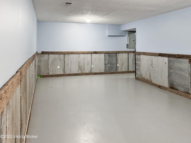 599 Ritchie Dr, Brandenburg, KY 40108 - finished basement with electric panel, a textured ceiling, and wainscoting
