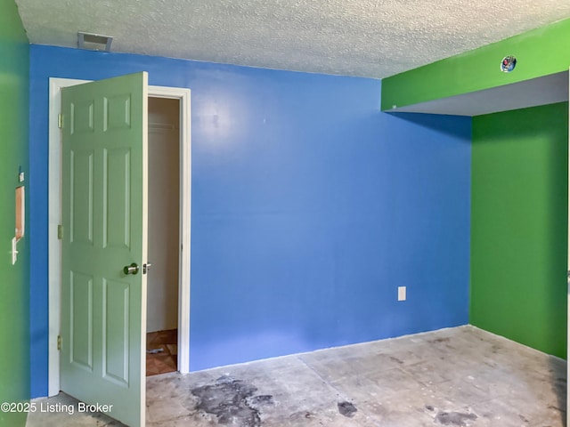 599 Ritchie Dr, Brandenburg, KY 40108 - spare room with a textured ceiling