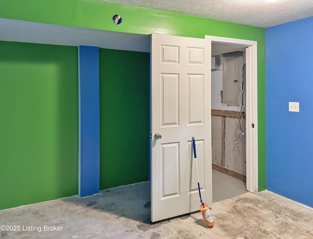 599 Ritchie Dr, Brandenburg, KY 40108 - unfurnished bedroom with concrete flooring and a textured ceiling