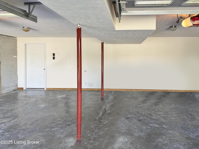 599 Ritchie Dr, Brandenburg, KY 40108 - garage with a garage door opener and baseboards