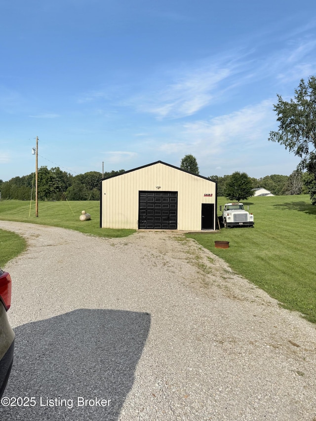 599 Ritchie Dr, Brandenburg, KY 40108 - view of pole building featuring a yard and driveway