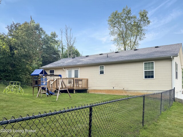 599 Ritchie Dr, Brandenburg, KY 40108 - back of property featuring a fenced backyard, a deck, and a playground