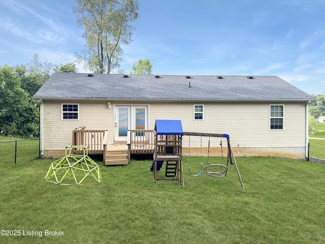 599 Ritchie Dr, Brandenburg, KY 40108 - rear view of house with a wooden deck, a playground, and roof with shingles