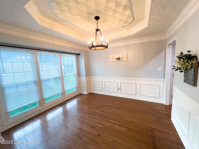 4212 Marseille Dr, Louisville, KY 40272 - unfurnished dining area with a raised ceiling, a chandelier, dark wood-style flooring, crown molding, and a wainscoted wall