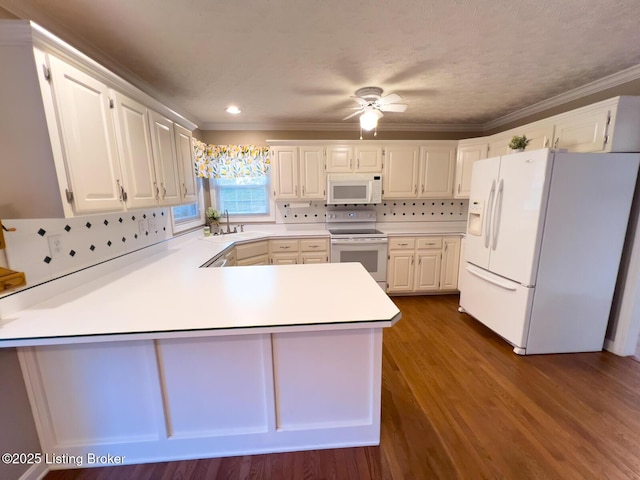 4212 Marseille Dr, Louisville, KY 40272 - kitchen featuring white appliances, a peninsula, light countertops, crown molding, and decorative backsplash