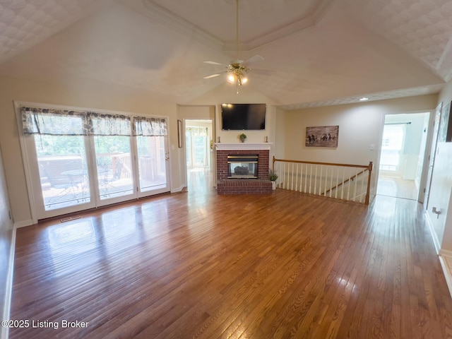4212 Marseille Dr, Louisville, KY 40272 - unfurnished living room featuring wood-type flooring, a ceiling fan, and a brick fireplace