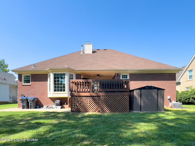 4212 Marseille Dr, Louisville, KY 40272 - back of house with a chimney, brick siding, and a lawn