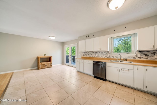 2700 Pioneer Ct, Radcliff, KY 40160 - kitchen featuring stainless steel dishwasher, tasteful backsplash, white cabinets, french doors, and light tile patterned flooring