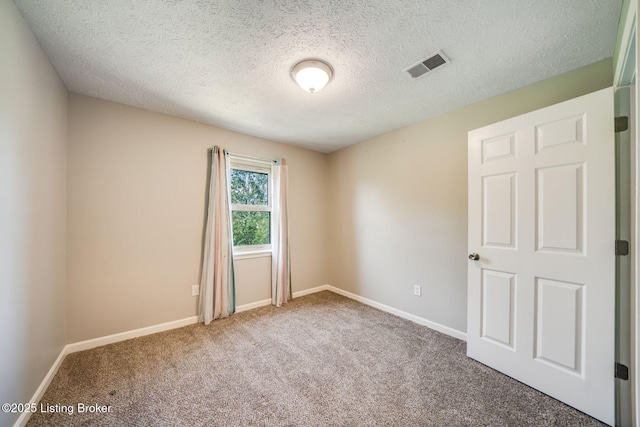2700 Pioneer Ct, Radcliff, KY 40160 - spare room with carpet floors and a textured ceiling