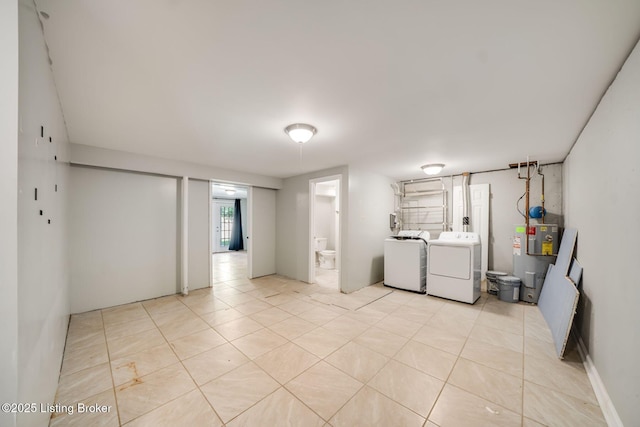 2700 Pioneer Ct, Radcliff, KY 40160 - basement with independent washer and dryer, electric water heater, and light tile patterned flooring