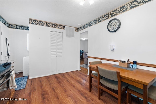 3706 Glenlea Way, Jeffersontown, KY 40299 - dining space with wood finished floors, washer / dryer, and a textured ceiling