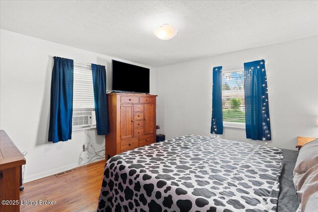 3706 Glenlea Way, Jeffersontown, KY 40299 - bedroom with wood finished floors and a textured ceiling