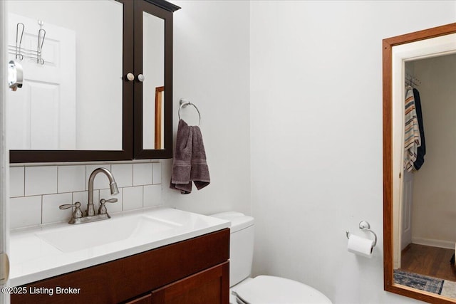 3706 Glenlea Way, Jeffersontown, KY 40299 - half bathroom with backsplash, vanity, and wood finished floors