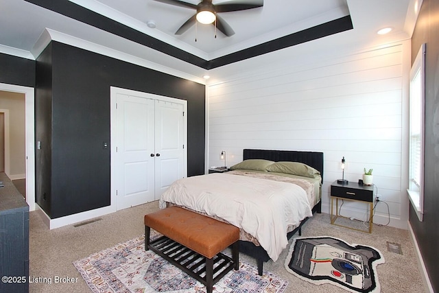 4017 Williams Crossing Way, Jeffersonville, IN 47130 - carpeted bedroom featuring ornamental molding, a closet, a raised ceiling, recessed lighting, and wooden walls