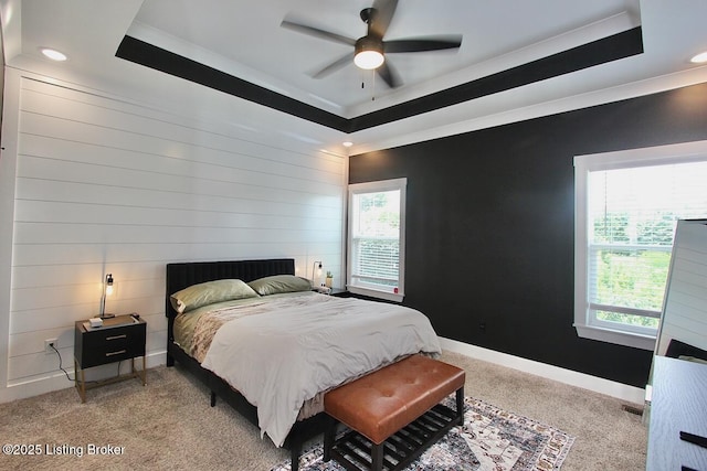4017 Williams Crossing Way, Jeffersonville, IN 47130 - carpeted bedroom with a tray ceiling, ornamental molding, recessed lighting, ceiling fan, and wooden walls