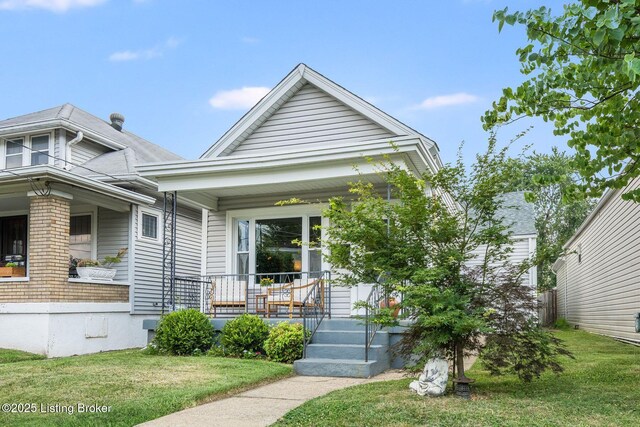 1021 Mulberry St, Louisville, KY 40217 - view of front of property featuring a porch and a front yard
