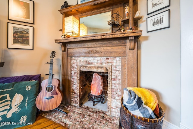 1021 Mulberry St, Louisville, KY 40217 - detailed view of a brick fireplace and wood finished floors
